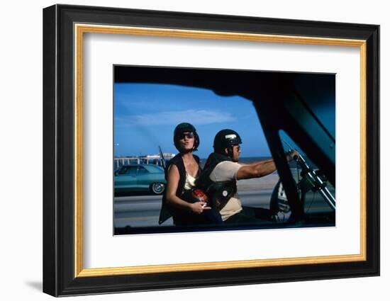 A Young Biker Sitting on the Motorbike Saddle with His Companion-Mario de Biasi-Framed Photographic Print