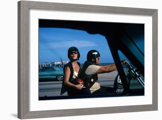 A Young Biker Sitting on the Motorbike Saddle with His Companion-Mario de Biasi-Framed Photographic Print