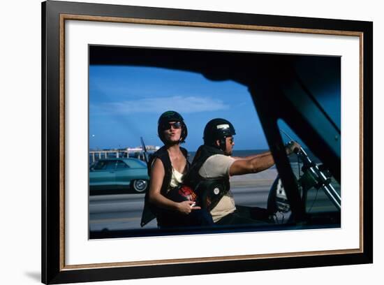 A Young Biker Sitting on the Motorbike Saddle with His Companion-Mario de Biasi-Framed Photographic Print