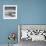 A Young Boy Kicks a Ball on Itamambuca Beach in Ubatuba, Brazil-Alex Saberi-Framed Photographic Print displayed on a wall