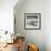 A Young Boy Kicks a Ball on Itamambuca Beach in Ubatuba, Brazil-Alex Saberi-Framed Photographic Print displayed on a wall