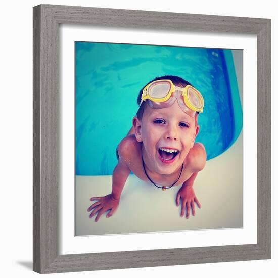 A Young Boy Swimming in a Small Pool-graphicphoto-Framed Photographic Print