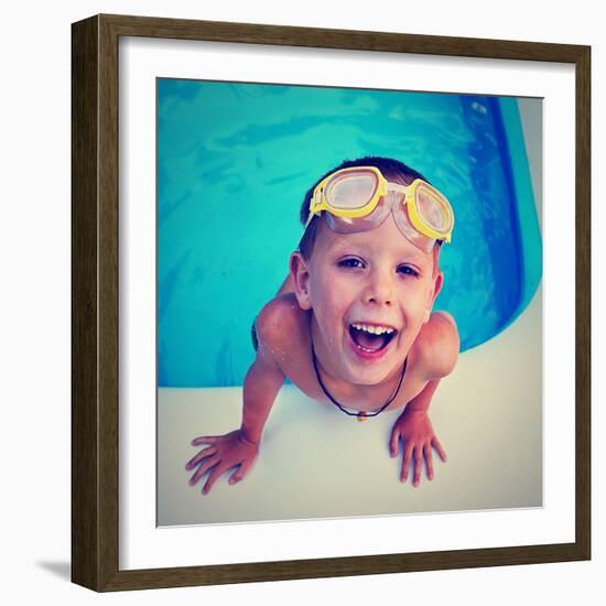 A Young Boy Swimming in a Small Pool-graphicphoto-Framed Photographic Print