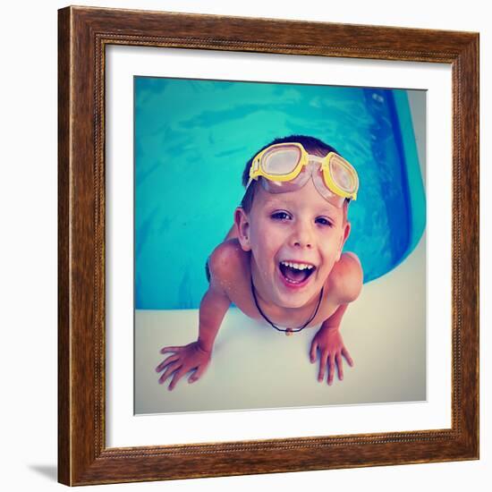 A Young Boy Swimming in a Small Pool-graphicphoto-Framed Photographic Print