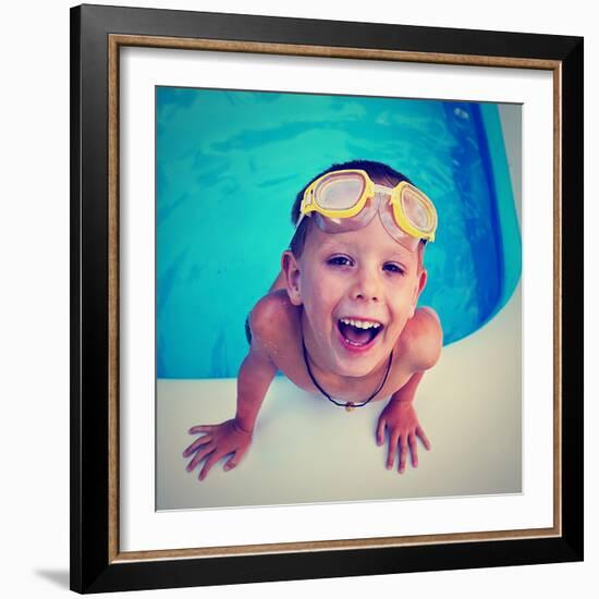 A Young Boy Swimming in a Small Pool-graphicphoto-Framed Photographic Print