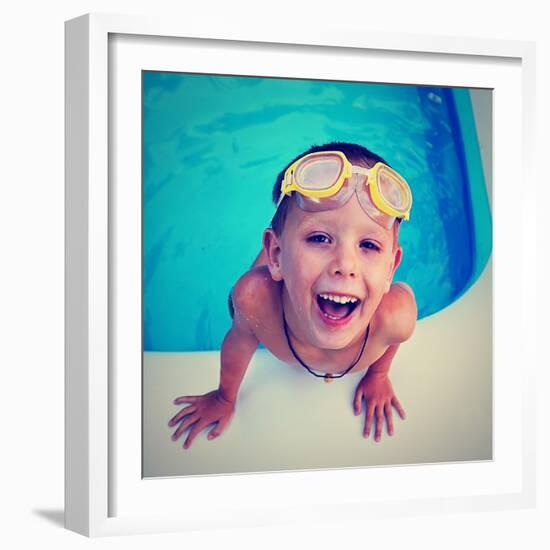 A Young Boy Swimming in a Small Pool-graphicphoto-Framed Photographic Print