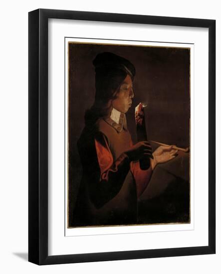 A young boy with a pipe, blowing on a firebrand-Georges De La Tour-Framed Giclee Print