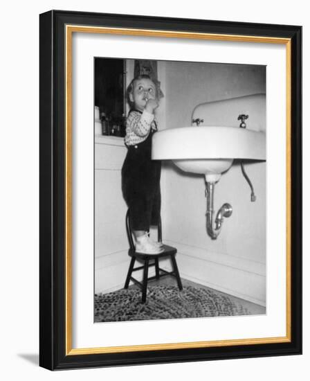 A Young Girl Brushes Her Teeth at the Sink, Ca. 1955-null-Framed Photographic Print