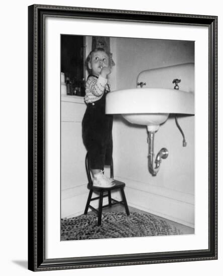 A Young Girl Brushes Her Teeth at the Sink, Ca. 1955-null-Framed Photographic Print