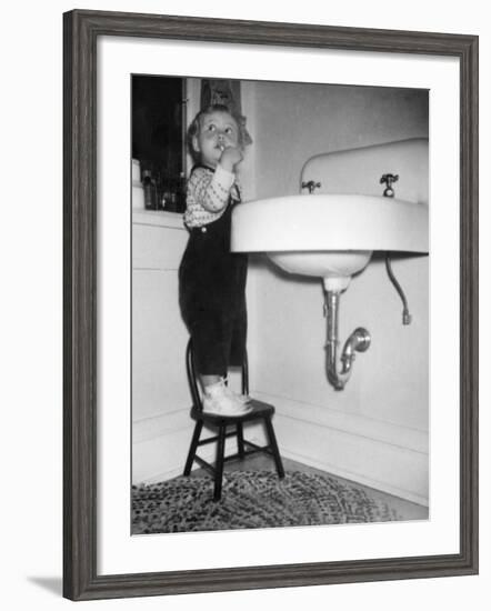 A Young Girl Brushes Her Teeth at the Sink, Ca. 1955-null-Framed Photographic Print