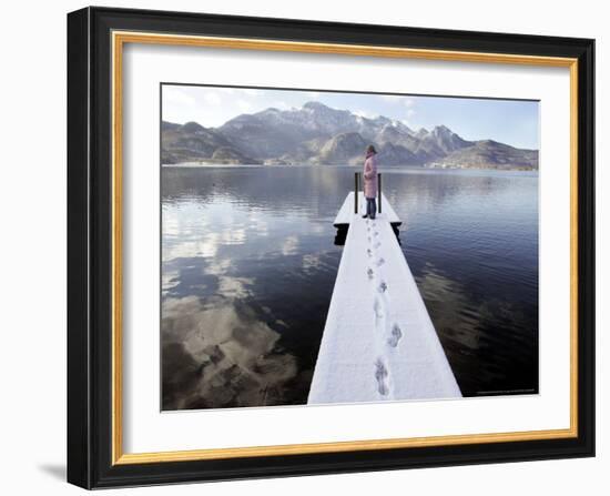 A Young Girl Enjoys the Sunny Winter Weather-Christof Stache-Framed Photographic Print