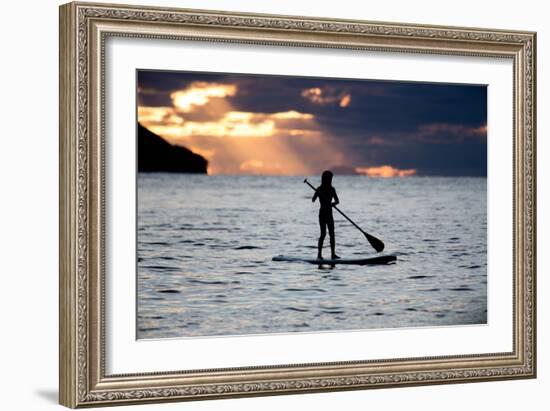 A Young Girl on a Stand Up Paddle Board on Baleia Beach at Sunset-Alex Saberi-Framed Photographic Print