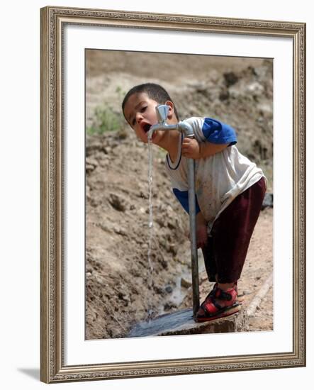 A Young Internally-Displaced Child at a Camp for Displaced Iraqis Who Have Fled Violence-null-Framed Photographic Print