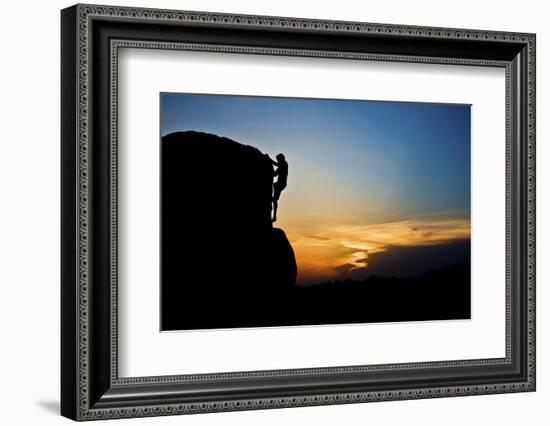 A Young Male Climber Climbs a Boulder Problem at Sunset in Hampi, India-Dan Holz-Framed Photographic Print