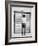 A Young Man Standing in the Street Looking at a Pair of Doors-India Hobson-Framed Photographic Print