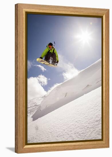 A Young Snowboarder Catching Air in the Wasatch Backcountry, Utah-Louis Arevalo-Framed Premier Image Canvas