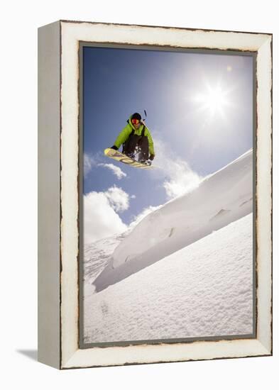 A Young Snowboarder Catching Air in the Wasatch Backcountry, Utah-Louis Arevalo-Framed Premier Image Canvas