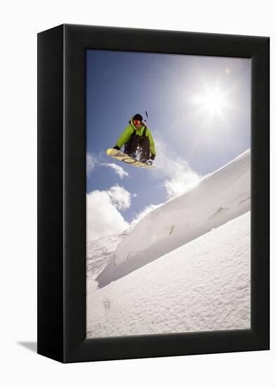 A Young Snowboarder Catching Air in the Wasatch Backcountry, Utah-Louis Arevalo-Framed Premier Image Canvas