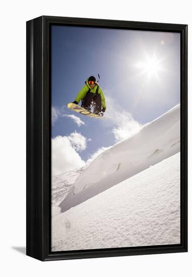 A Young Snowboarder Catching Air in the Wasatch Backcountry, Utah-Louis Arevalo-Framed Premier Image Canvas