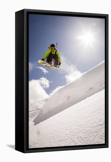 A Young Snowboarder Catching Air in the Wasatch Backcountry, Utah-Louis Arevalo-Framed Premier Image Canvas