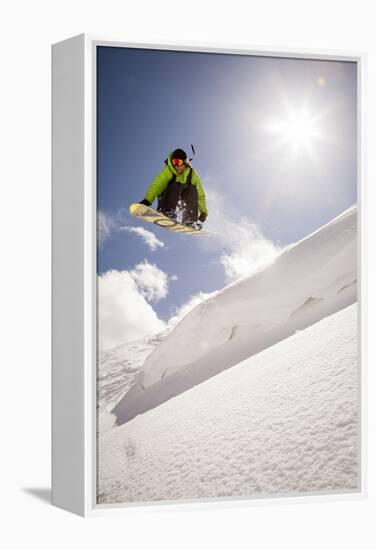 A Young Snowboarder Catching Air in the Wasatch Backcountry, Utah-Louis Arevalo-Framed Premier Image Canvas