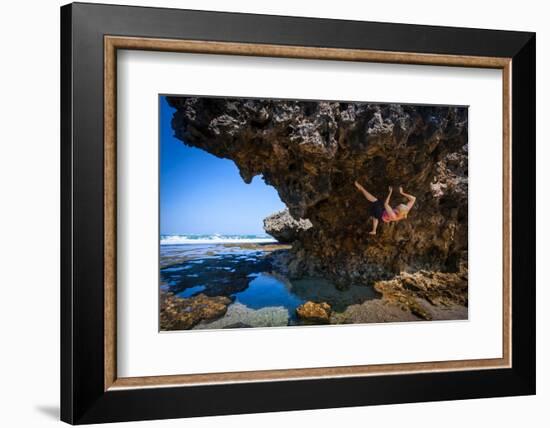 A Young Woman Climbs on a Low-Tide Boulder in Siung Beach Just Outside Yogyakarta, Indonesia-Dan Holz-Framed Photographic Print