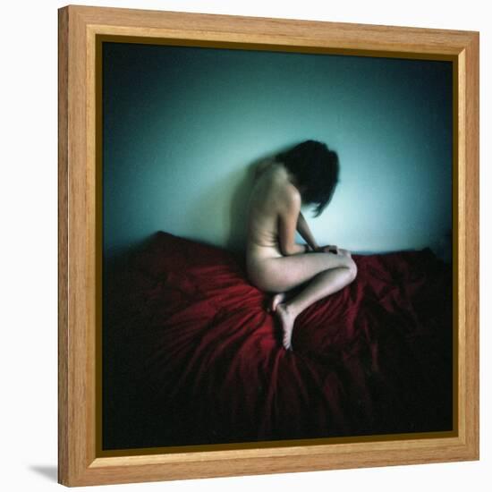 A Young Woman Sat on a Red Bed Sheet-Rafal Bednarz-Framed Premier Image Canvas