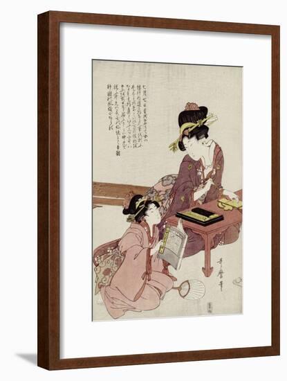 A Young Woman Seated at a Desk Writing, a Girl with a Book Looks On-Kitagawa Utamaro-Framed Giclee Print