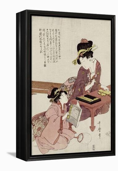 A Young Woman Seated at a Desk Writing, a Girl with a Book Looks On-Kitagawa Utamaro-Framed Premier Image Canvas