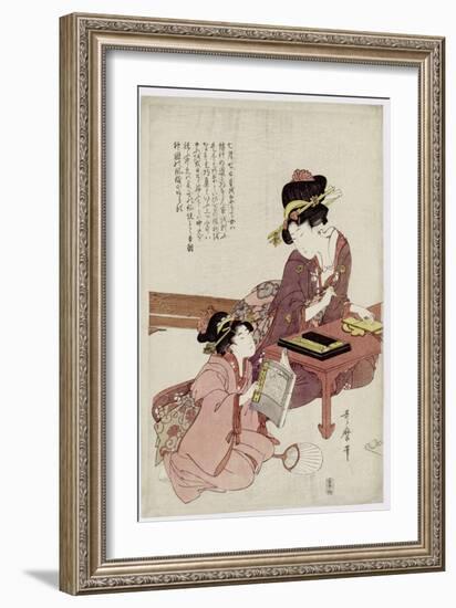 A Young Woman Seated at a Desk, Writing, a Girl with a Book Looks On-Kitagawa Utamaro-Framed Giclee Print