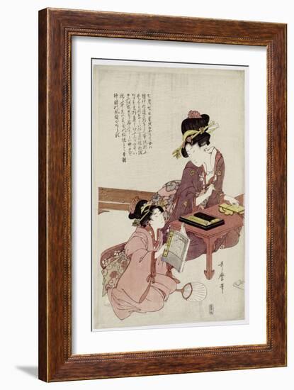 A Young Woman Seated at a Desk, Writing, a Girl with a Book Looks On-Kitagawa Utamaro-Framed Giclee Print