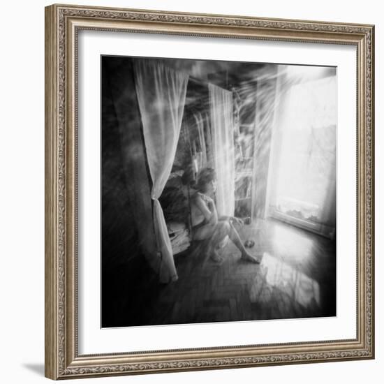 A Young Woman Smoking a Cigarette Seated in the Sunlight Shining through a Window-Rafal Bednarz-Framed Photographic Print