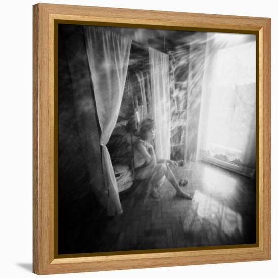 A Young Woman Smoking a Cigarette Seated in the Sunlight Shining through a Window-Rafal Bednarz-Framed Premier Image Canvas