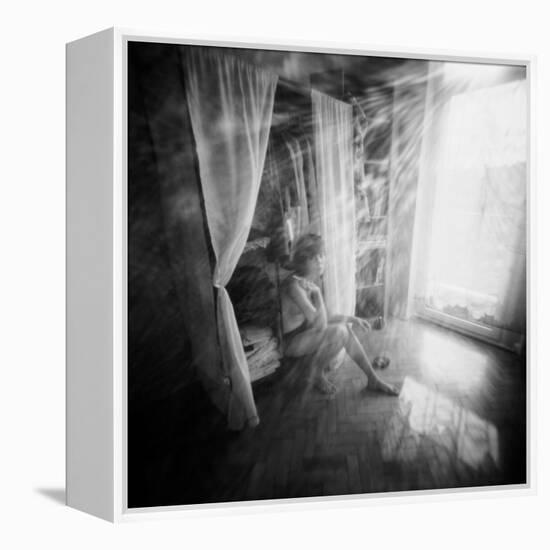 A Young Woman Smoking a Cigarette Seated in the Sunlight Shining through a Window-Rafal Bednarz-Framed Premier Image Canvas