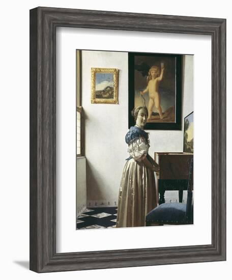 A Young Woman Standing at a Virginal-Johannes Vermeer-Framed Art Print