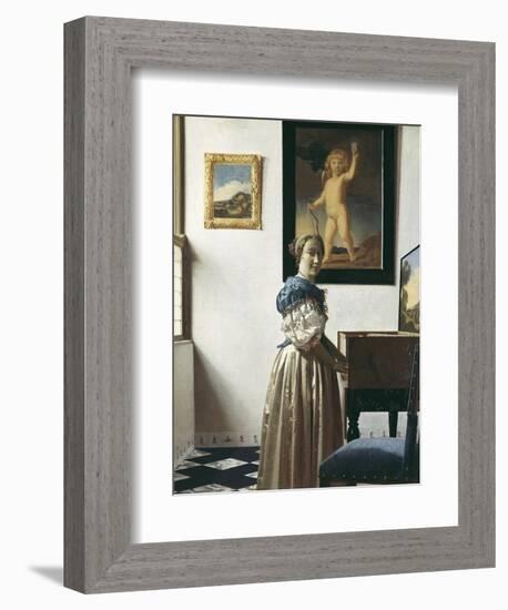 A Young Woman Standing at a Virginal-Johannes Vermeer-Framed Art Print