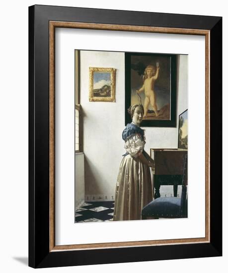 A Young Woman Standing at a Virginal-Johannes Vermeer-Framed Art Print