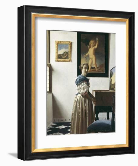 A Young Woman Standing at a Virginal-Johannes Vermeer-Framed Art Print