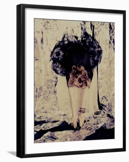 A Young Woman with Red Hair Leaning Forward and Touching Her Toes-India Hobson-Framed Photographic Print