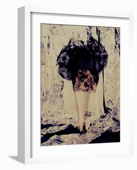 A Young Woman with Red Hair Leaning Forward and Touching Her Toes-India Hobson-Framed Photographic Print