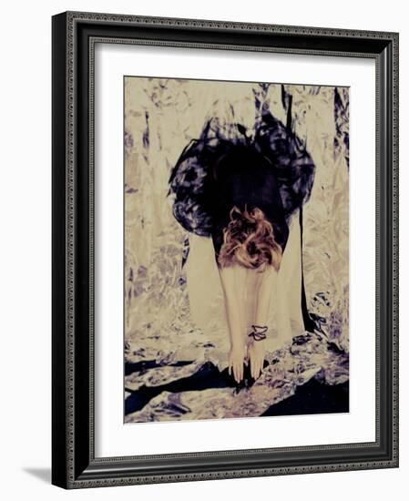 A Young Woman with Red Hair Leaning Forward and Touching Her Toes-India Hobson-Framed Photographic Print