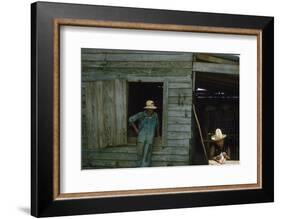 A Young Women Plucks Feathers from a Chicken, Edisto Island, South Carolina, 1956-Walter Sanders-Framed Photographic Print