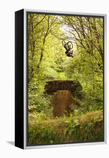 Aalen, Baden-Württemberg, Germany: A Young Freestyle Mt Biker Riding At A Secret Dirt Jump Spot-Axel Brunst-Framed Premier Image Canvas