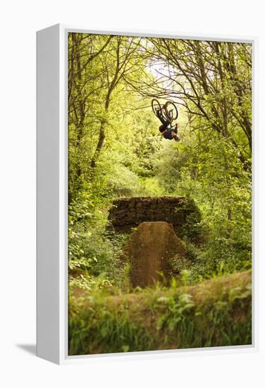 Aalen, Baden-Württemberg, Germany: A Young Freestyle Mt Biker Riding At A Secret Dirt Jump Spot-Axel Brunst-Framed Premier Image Canvas