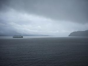 A Ferry Boat Moves Through Stormy Weather From Vashon Island to West Seattle. Washington State, USA by Aaron McCoy