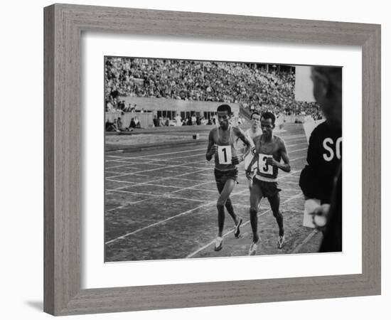 Abebe Bikila and Mamo Wolde in Exhibition Race at Berlin Olympic Stadium-null-Framed Premium Photographic Print