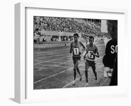 Abebe Bikila and Mamo Wolde in Exhibition Race at Berlin Olympic Stadium-null-Framed Premium Photographic Print