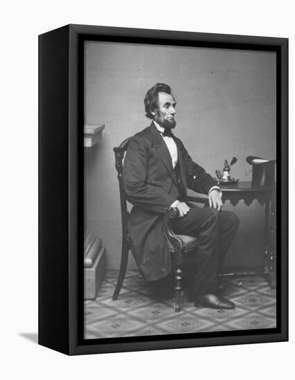 Abraham Lincoln, full-length portrait, seated, 1861-Alexander Gardner-Framed Premier Image Canvas