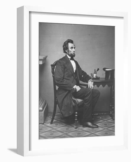 Abraham Lincoln, full-length portrait, seated, 1861-Alexander Gardner-Framed Photographic Print