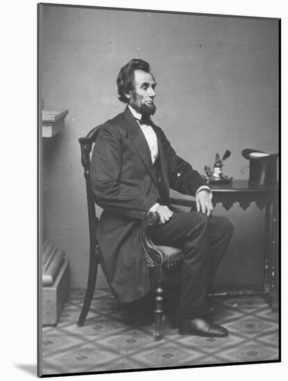 Abraham Lincoln, full-length portrait, seated, 1861-Alexander Gardner-Mounted Photographic Print